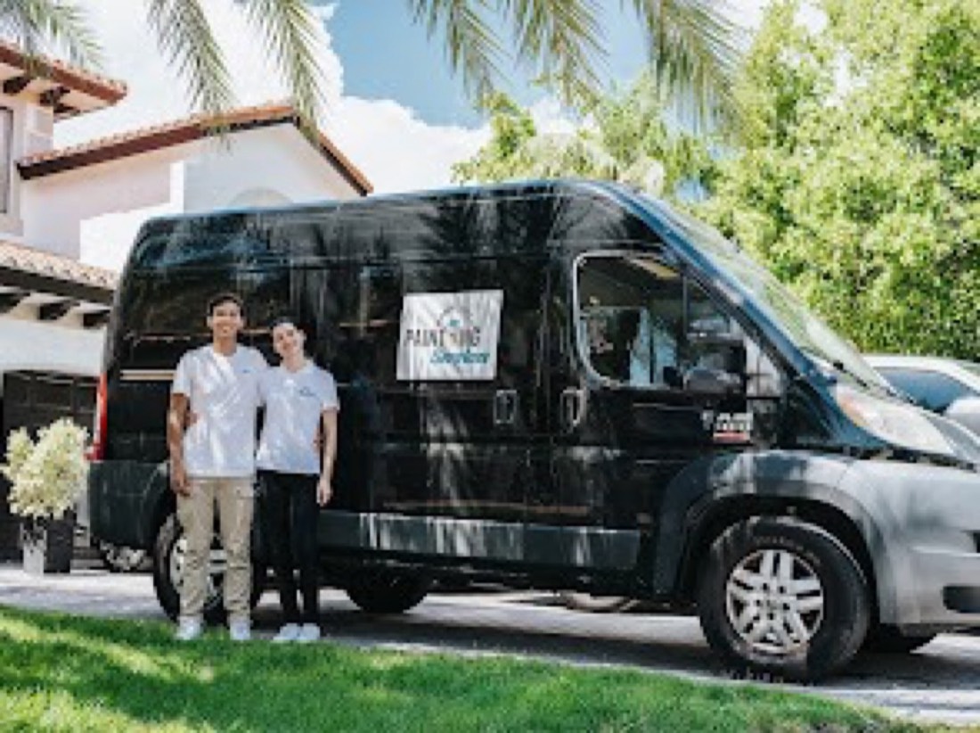 The Mana Painting Services team and company van outside a Miami home